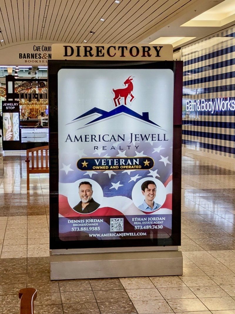 American Jewell Realty directory signage at a Columbia mall, featuring the Veteran Owned and Operated badge
