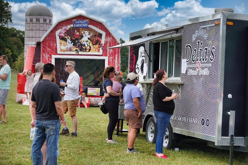 The food truck and bounce house at Farm Day